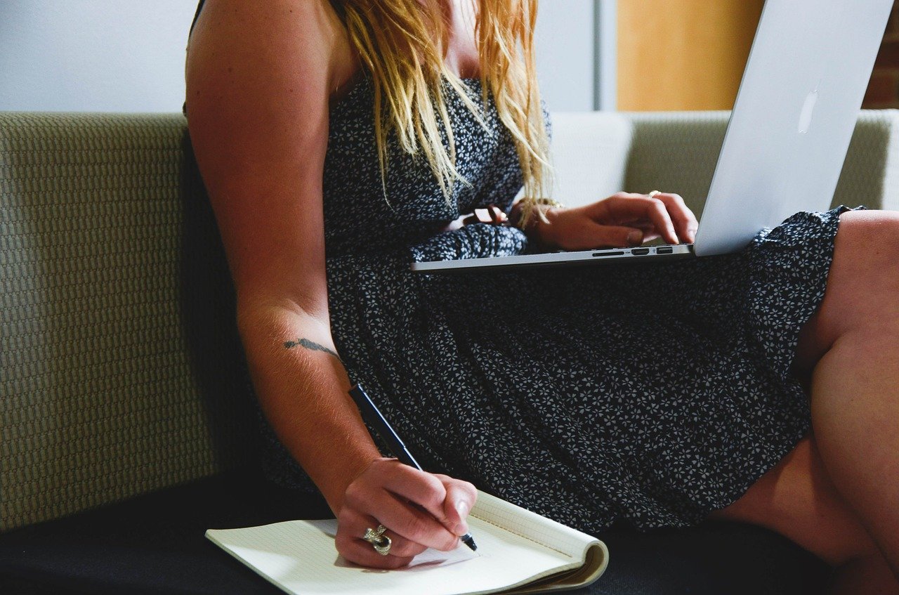 woman laptop taking notes woman laptop taking notes