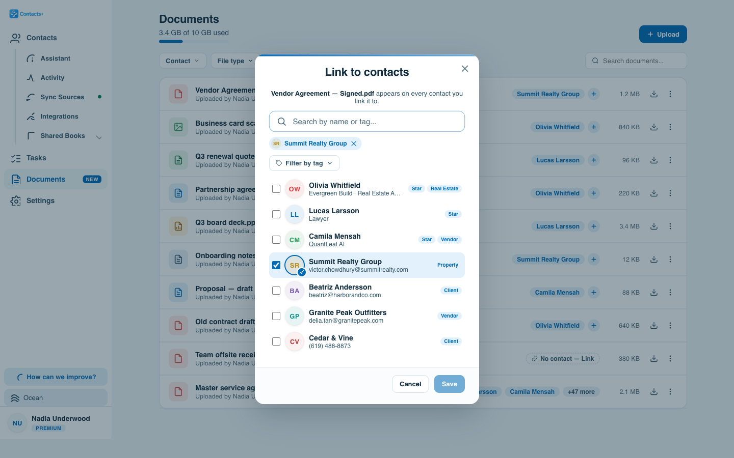 The Link to contacts dialog for a signed vendor agreement, with a searchable, tag-filterable list of contacts and checkboxes so the same file can be linked to several people and companies at once.